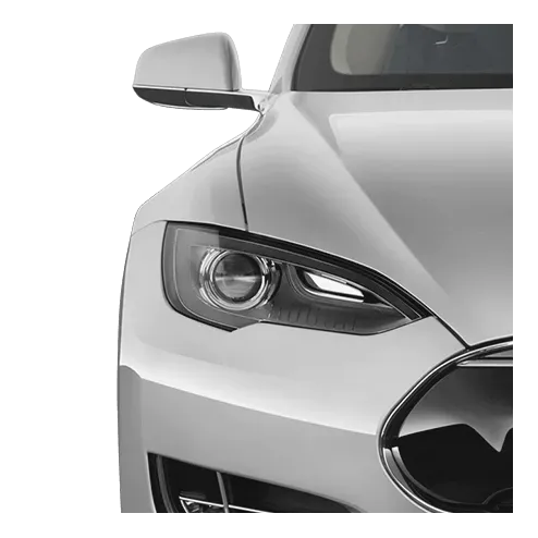 Silver Tesla car, front view, showing headlight and side mirror.