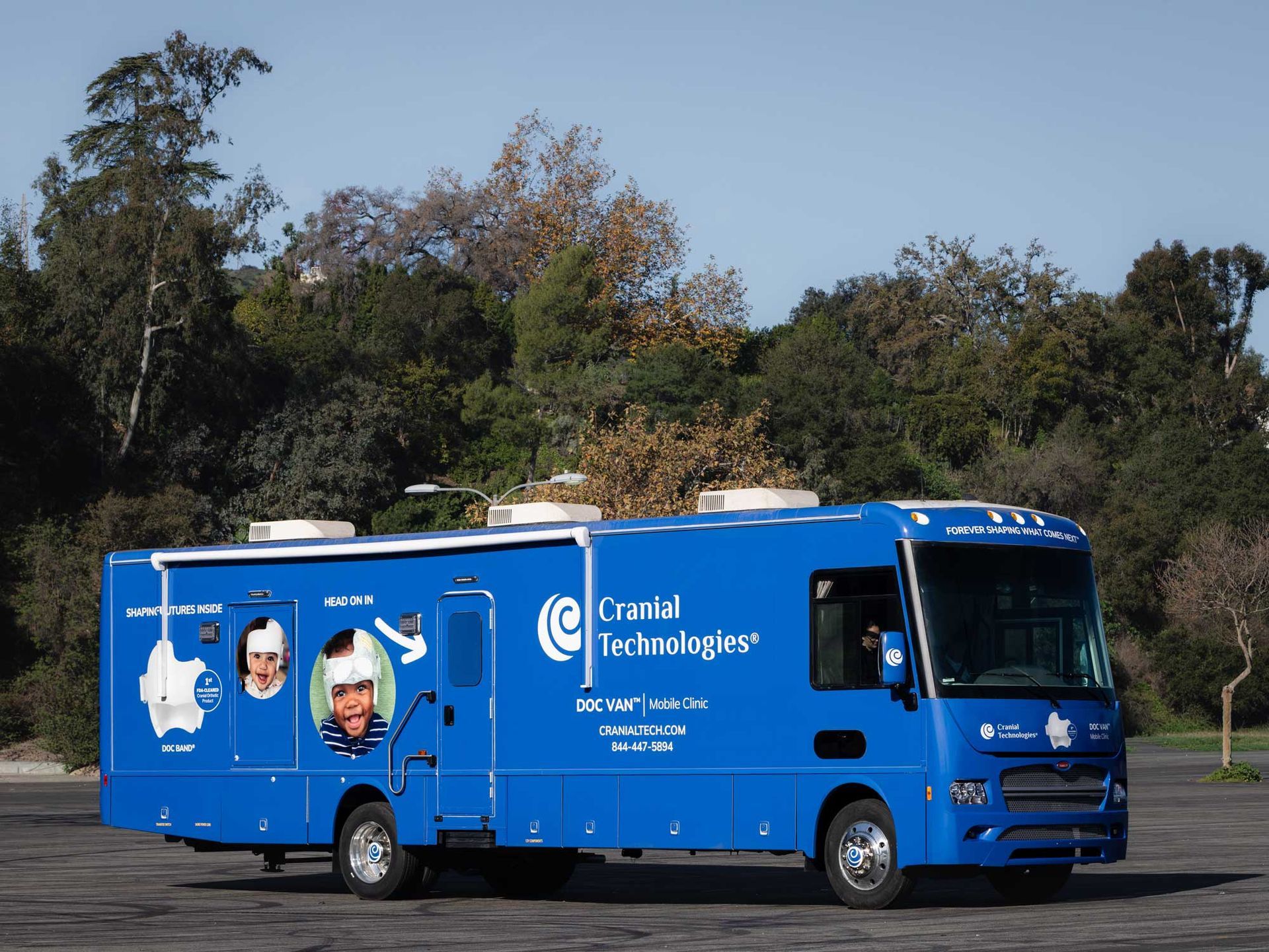 Side view of the Cranial Technologies DOC Van mobile clinic.