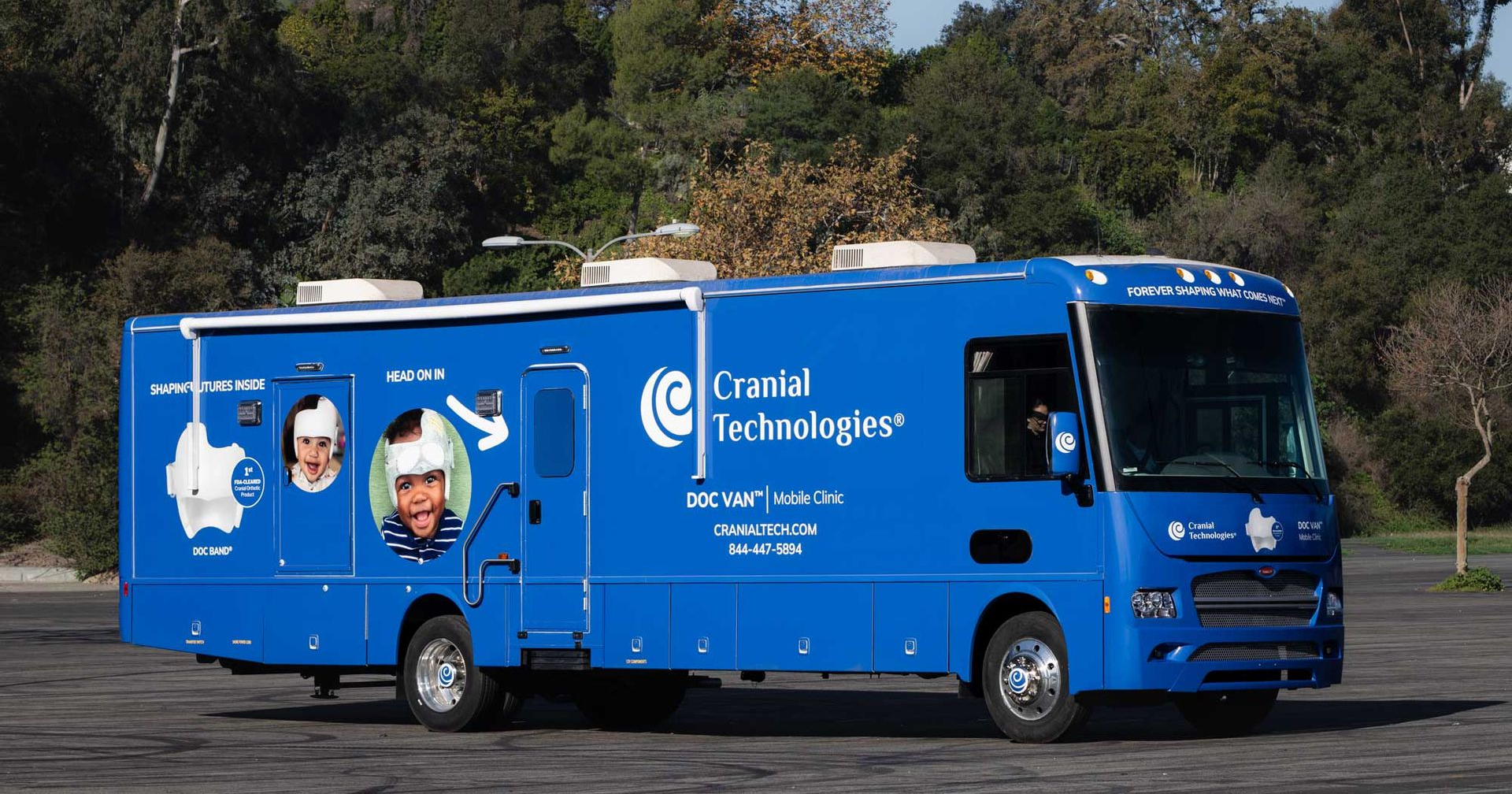 Blue Cloud Technologies service truck parked outdoors, with promotional graphics on the side.