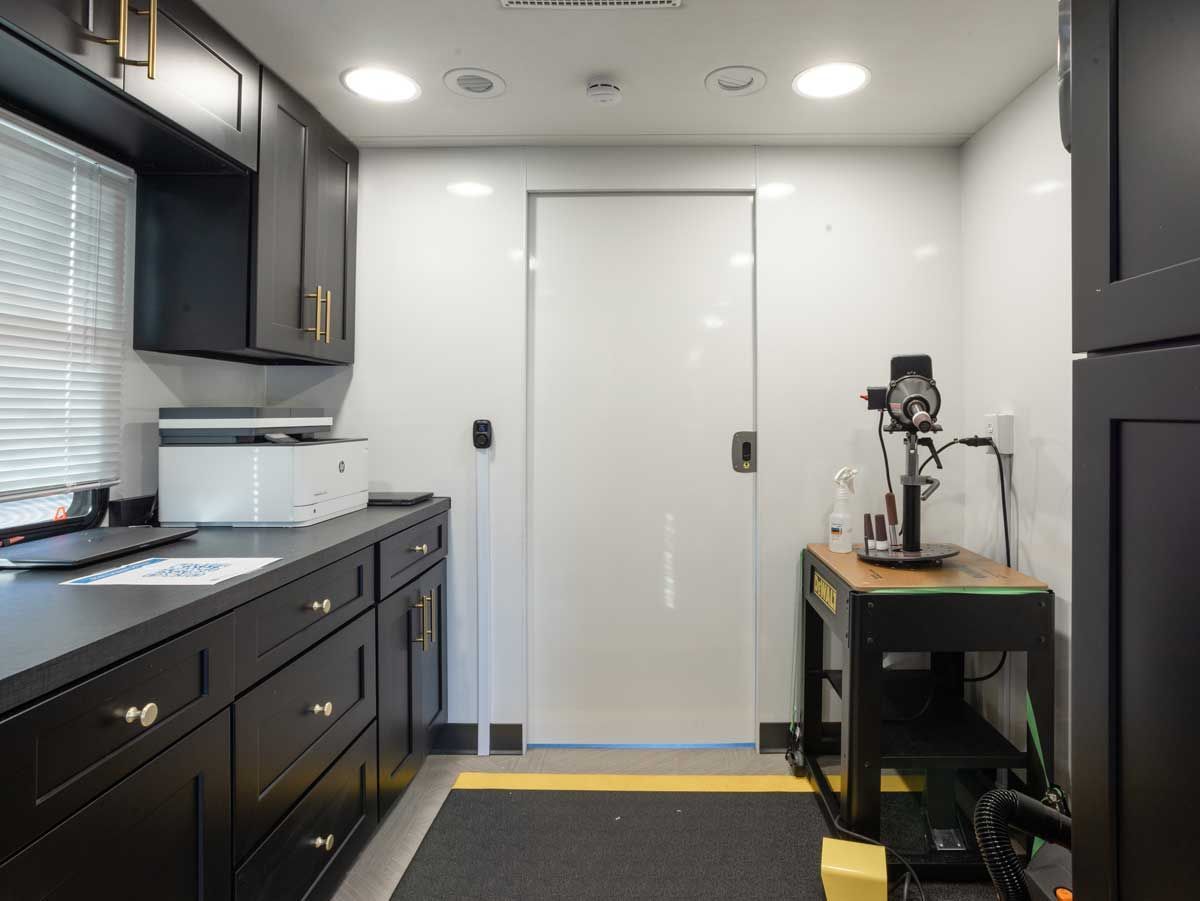 Interior storage and equipment area inside the Cranial Technologies mobile clinic.
