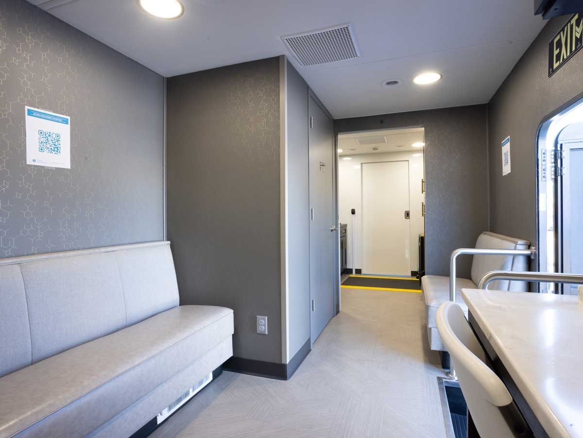 Patient waiting room inside the Cranial Technologies mobile clinic.
