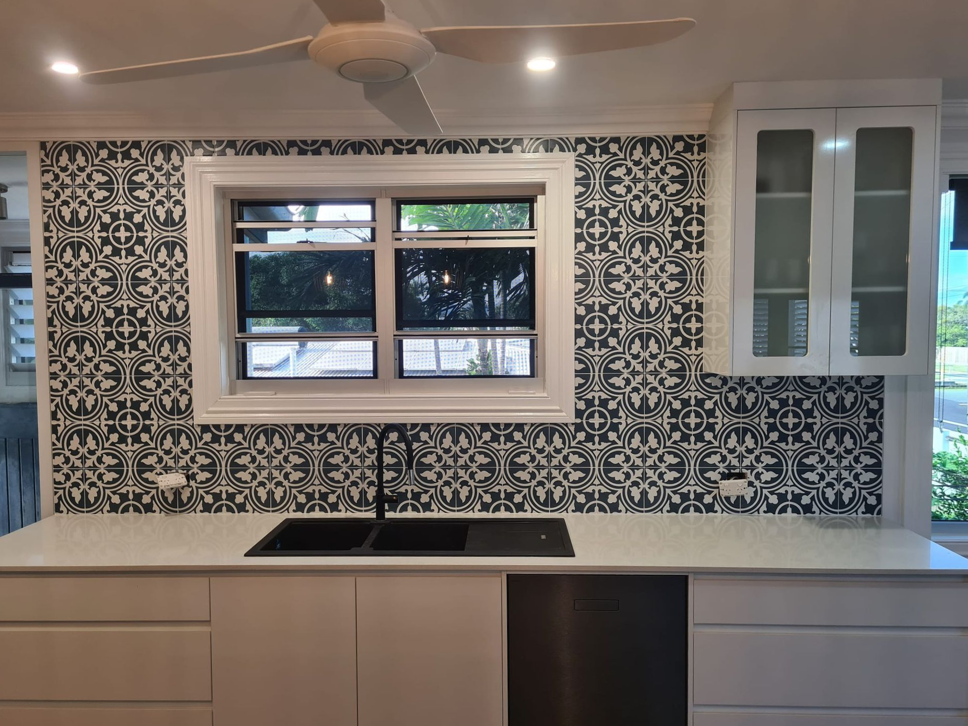 Modern White Kitchen With Gray Countertops and Marble Floors — Tropic Tiling in Tolga, QLD