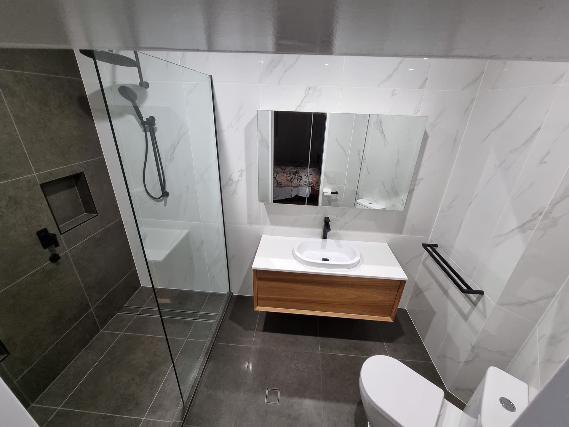 Modern Bathroom With a Shower, Vanity, and Toilet — Tropic Tiling in Atherton, QLD