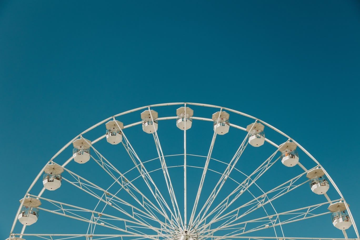 Ferris wheel against a clear blue sky