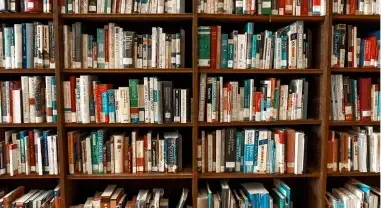 Rows of bookshelves filled with assorted books in a library or bookstore