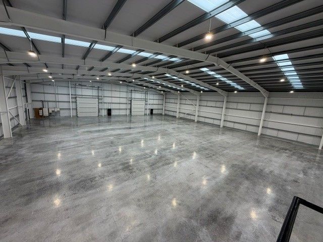 Large warehouse interior with polished factory floor