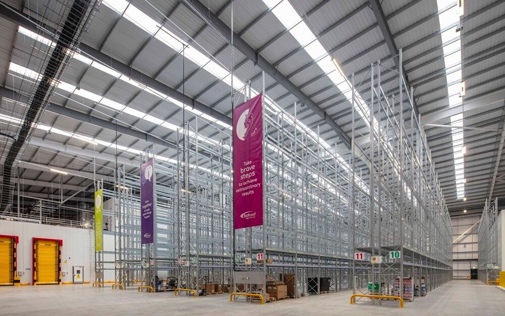 Modern industrial warehouse storage areas, viewed from the side.