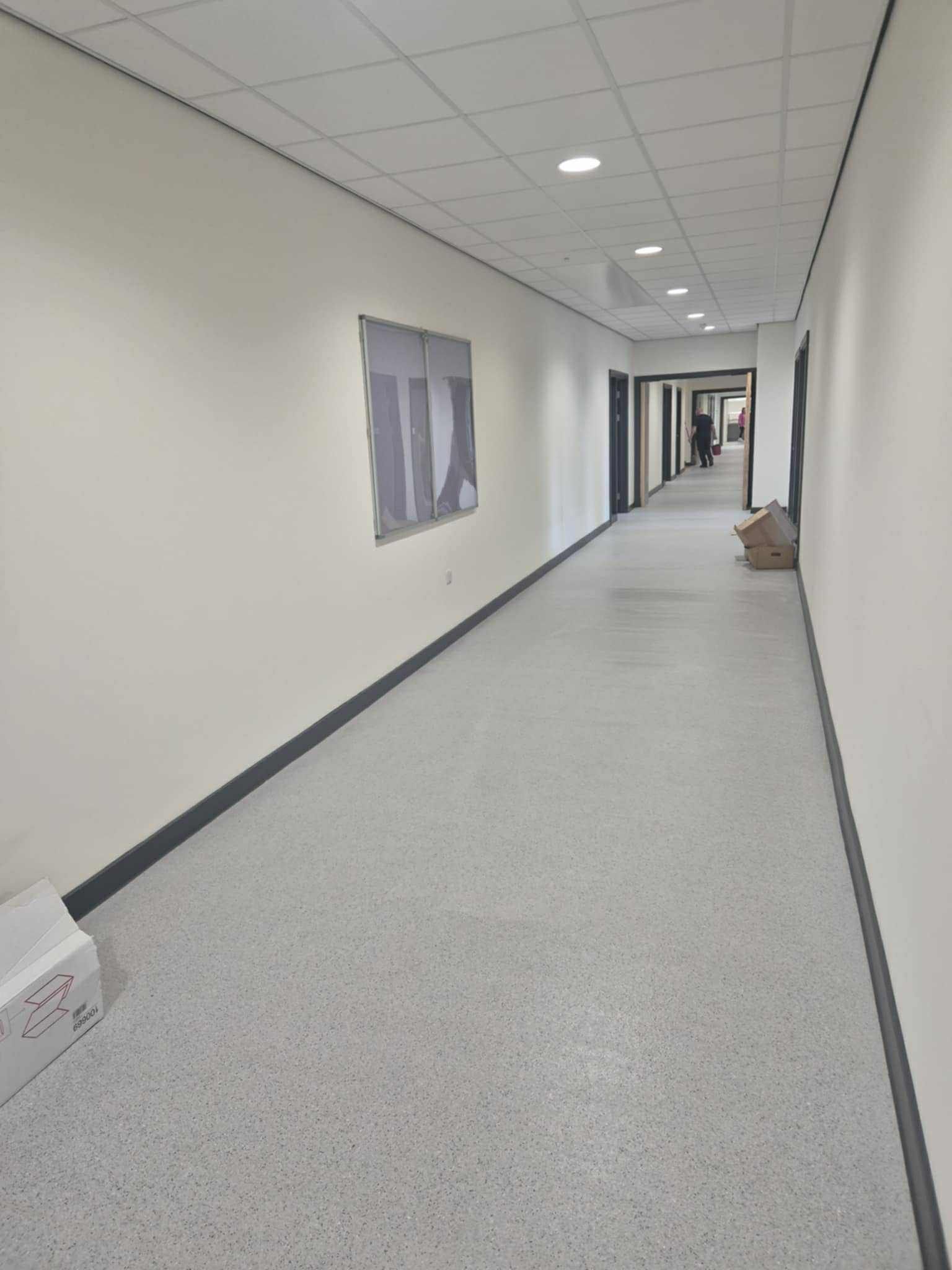 Modern school corridor following builders and sparkle clean 