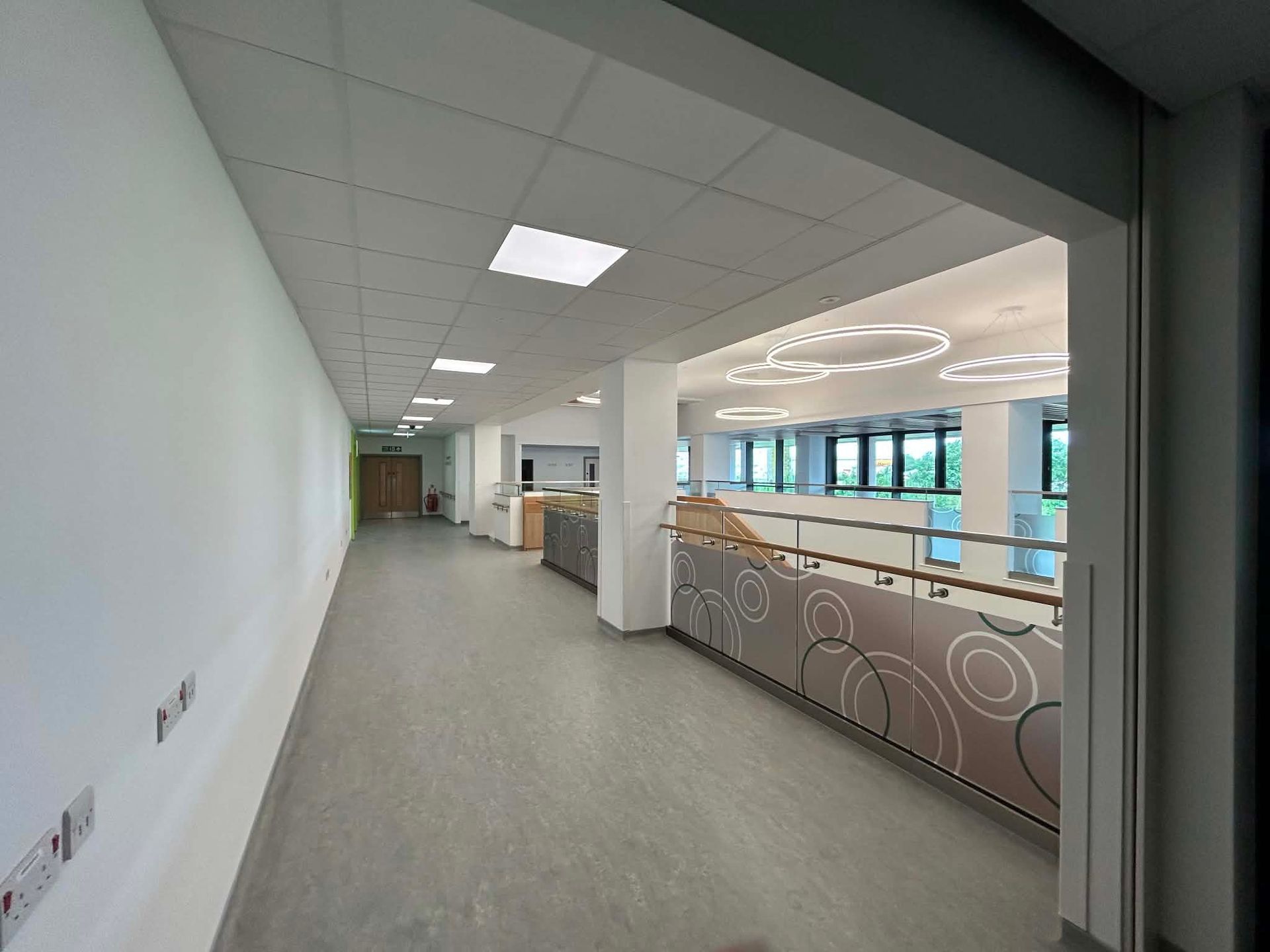 Hospital circulation space overlooking the reception area 