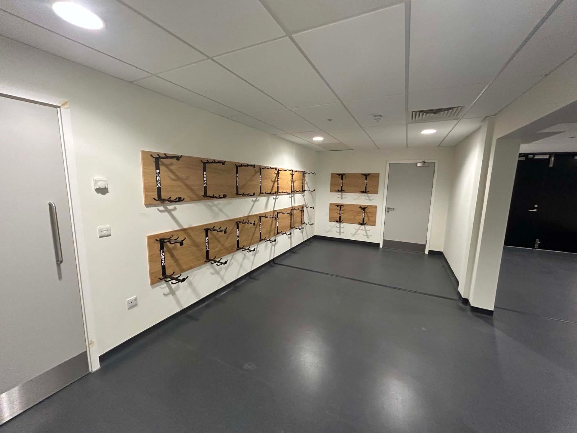 Player changing area with lockers and bench seating after cleaning 