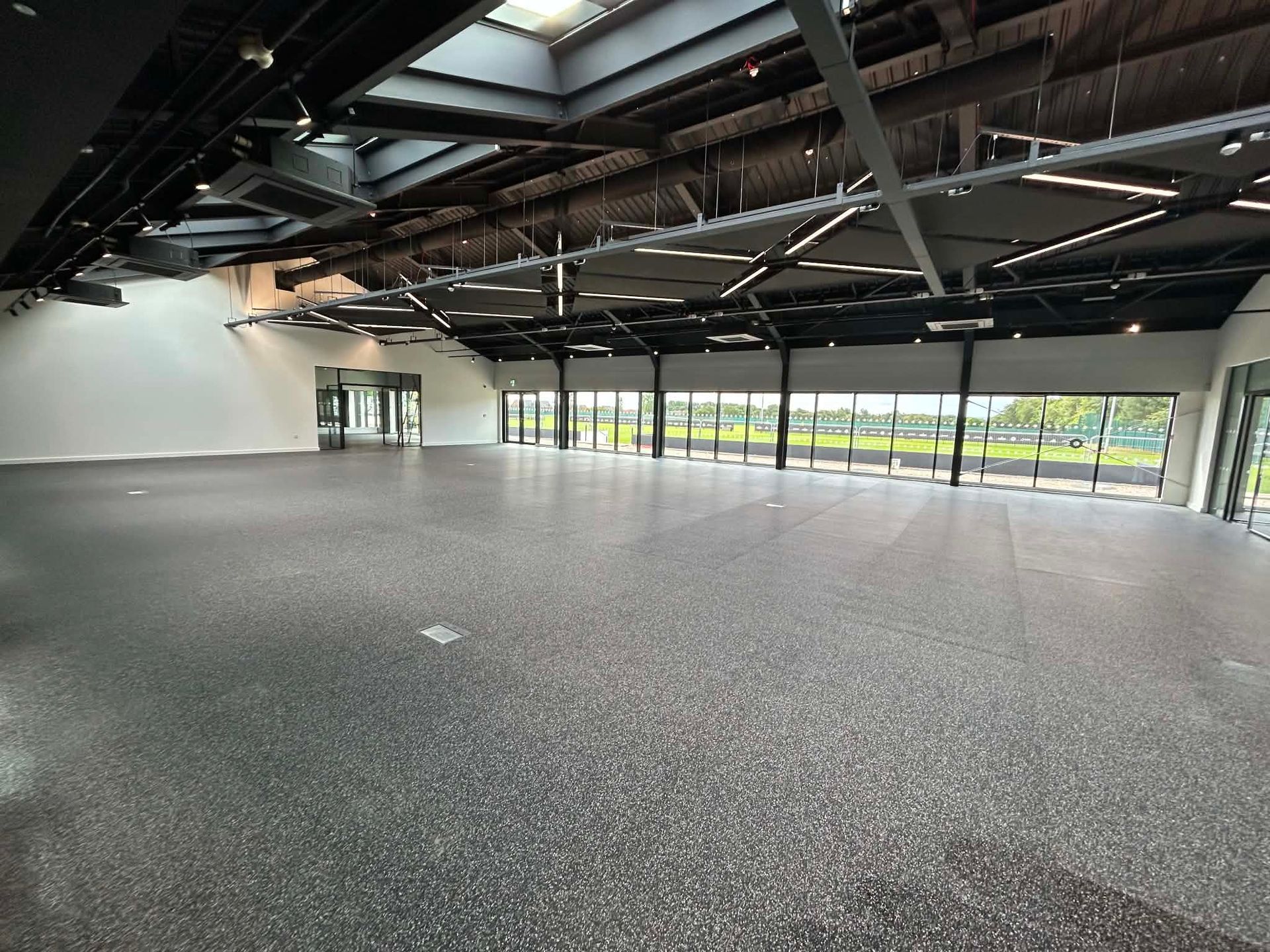Large open training space with high-level ceiling structure