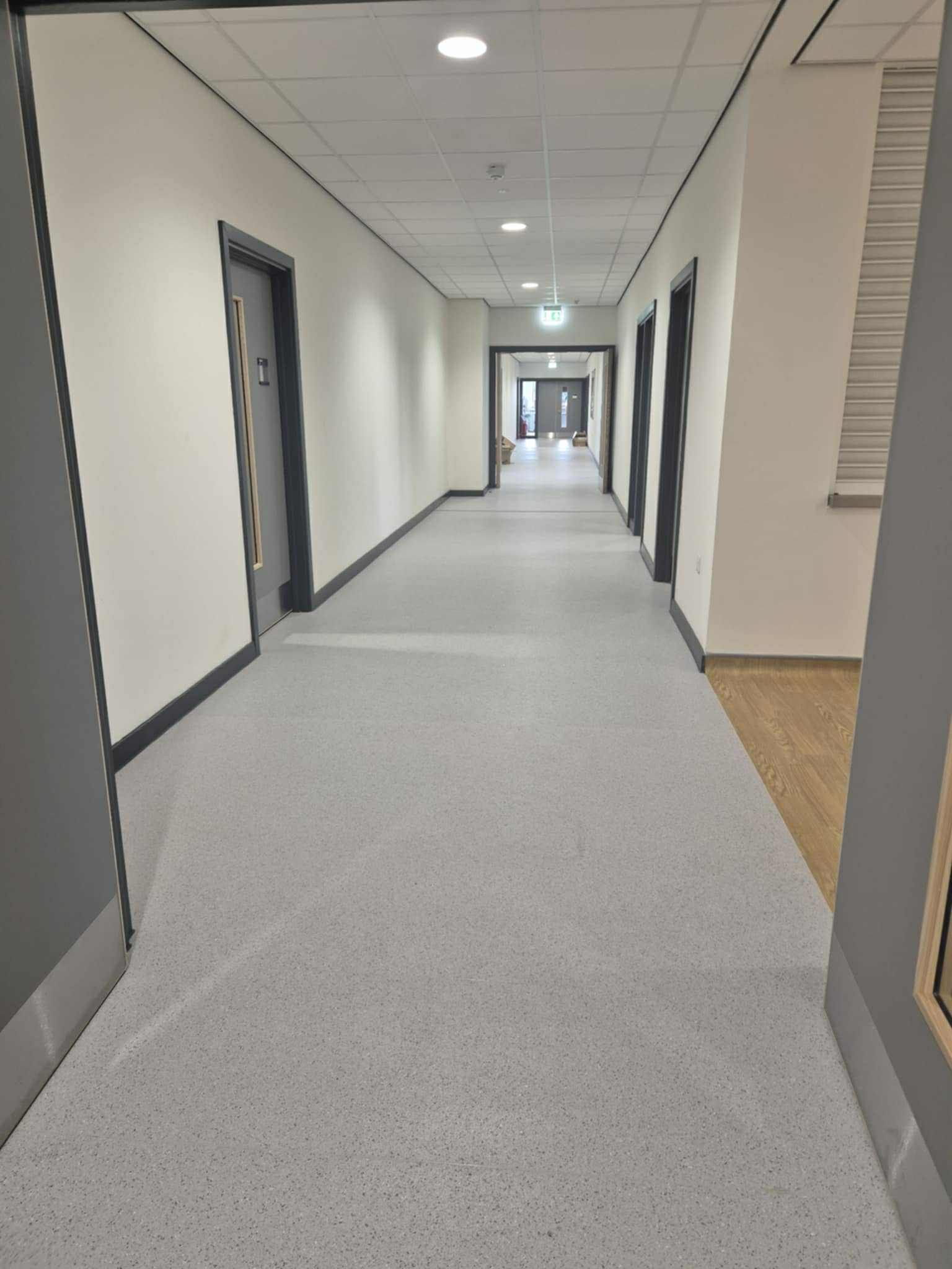 Long internal corridor cleaned for construction handover at Callerton Academy