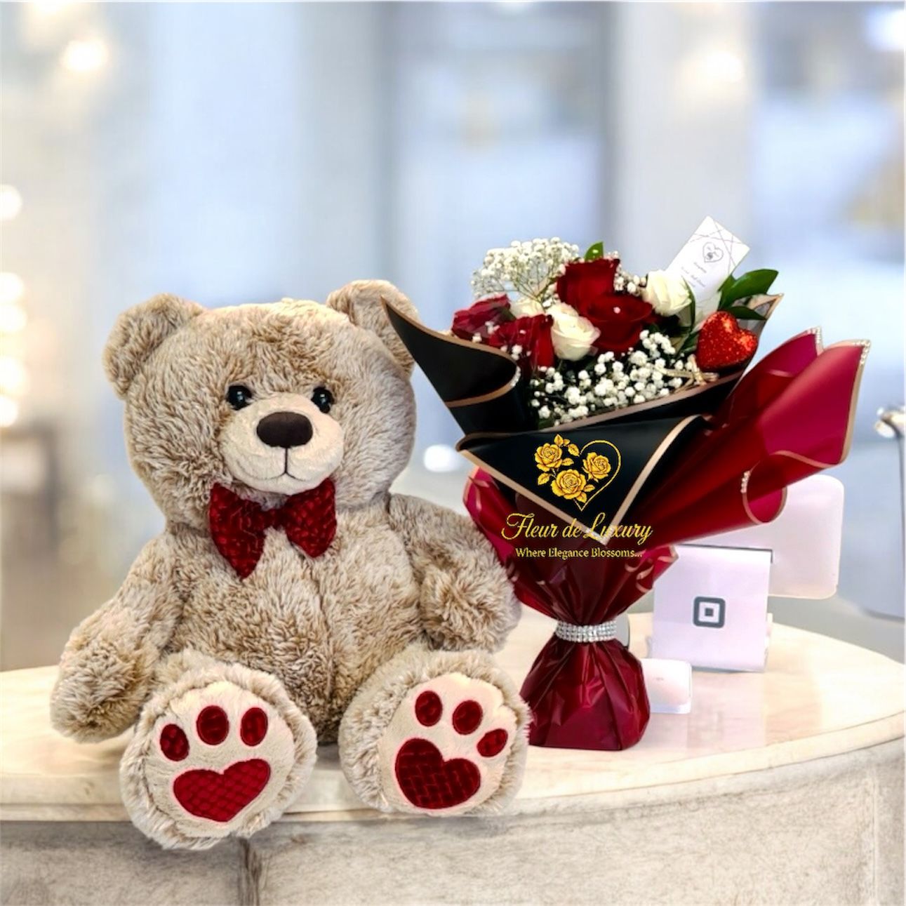 big teddy bear with flowers and chocolate