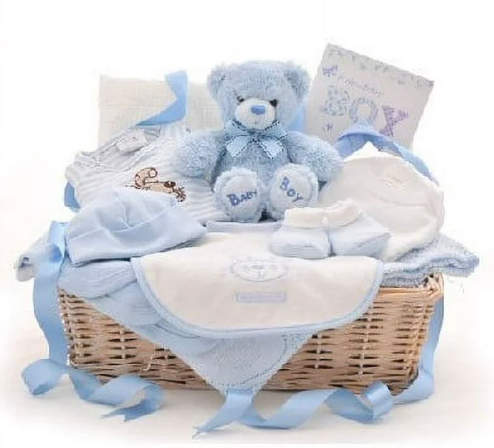 Baby boy gift basket with blue teddy bear, clothes, and accessories.