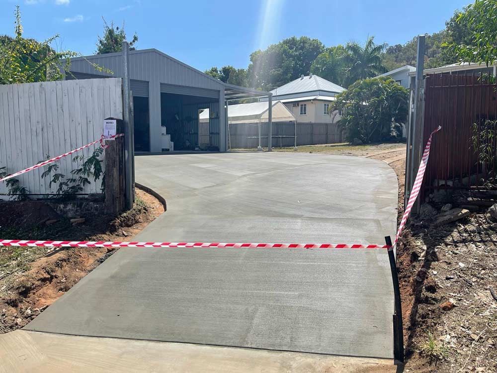 Plain Concrete Driveway — Experienced Concreter in Mount Low, QLD