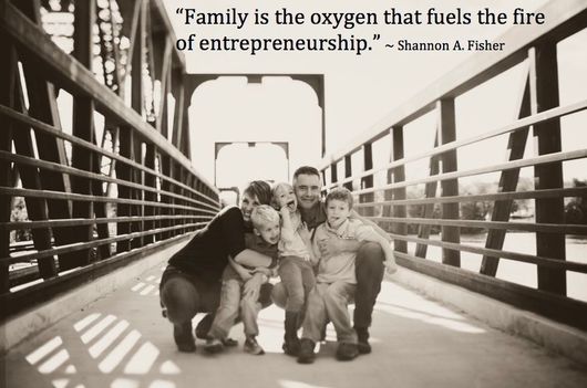 Shannon A Fisher Family  portrait on a bridge with a quote about entrepreneurship overhead, in warm sepia tones