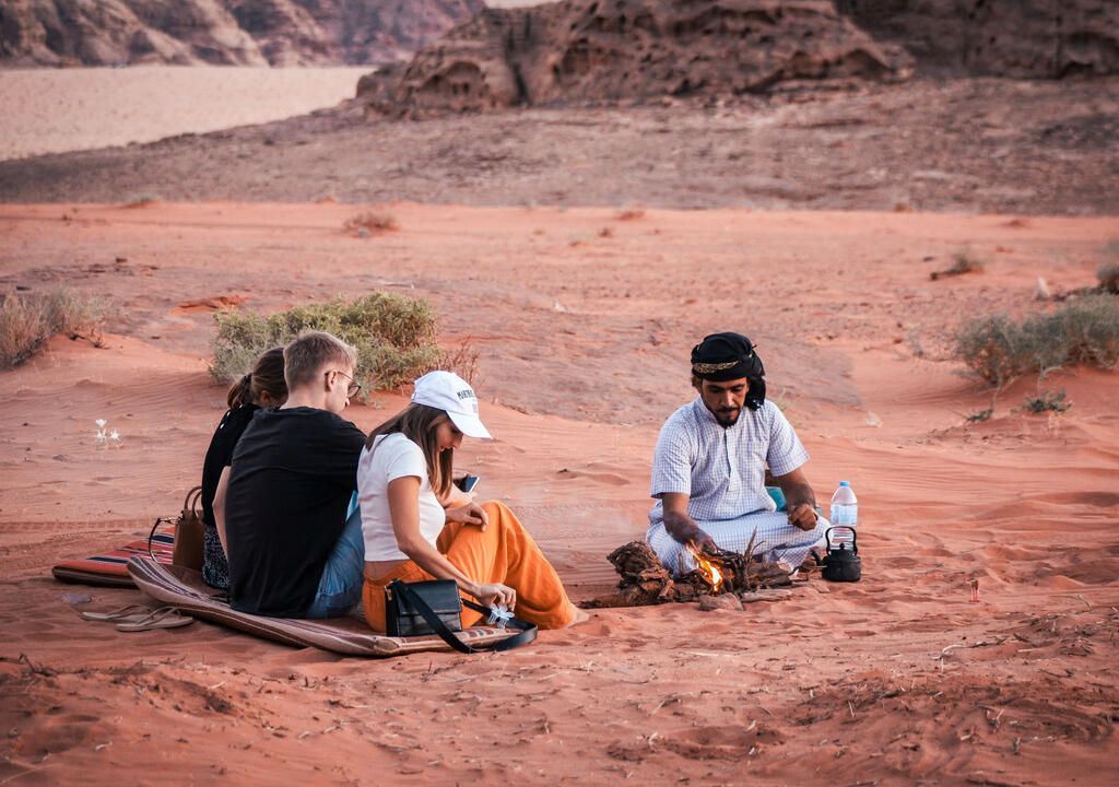 Traditional Bedouin tea served beside a campfire in Wadi Rum