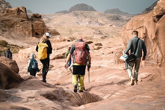 Hikers trekking through the stunning desert landscape of Wadi Rum, Jordan