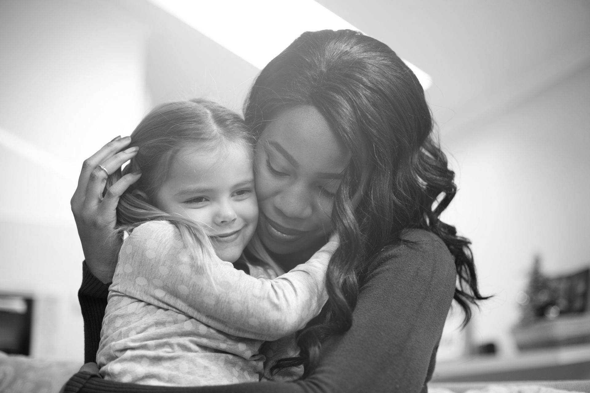 A woman holding a little girl.