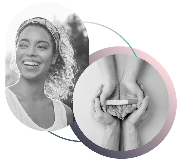 Black and white image showing smiling woman and hands holding a positive pregnancy test together.