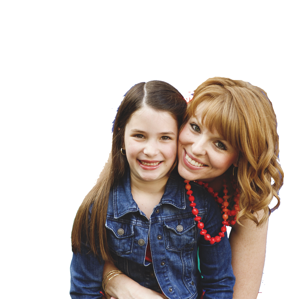 A woman is hugging a little girl who is wearing a denim jacket