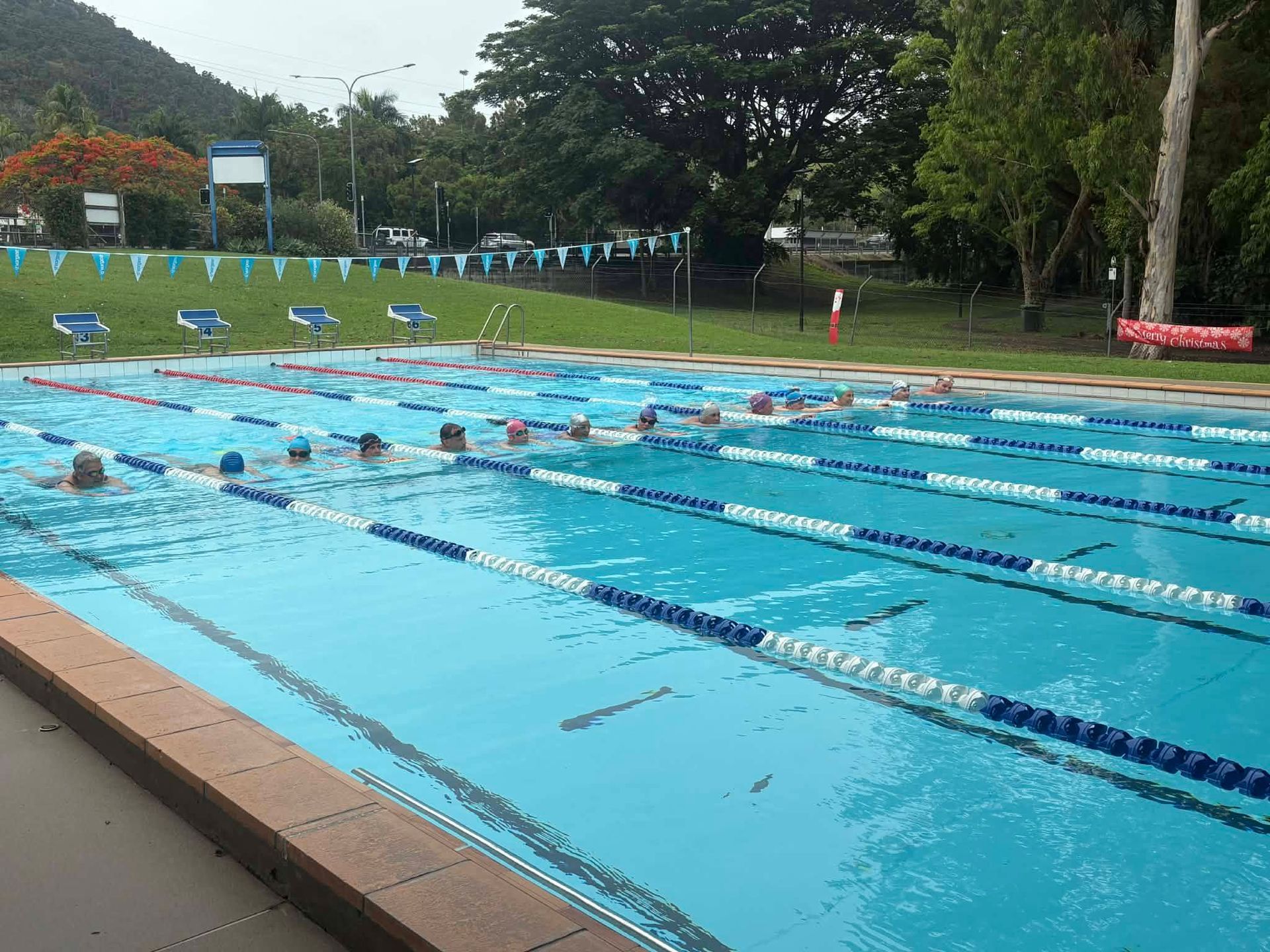Swimmers Lap in an Outdoor Pool Divided by Lane Ropes — Cannonvale Swim Centre In Cannonvale, QLD