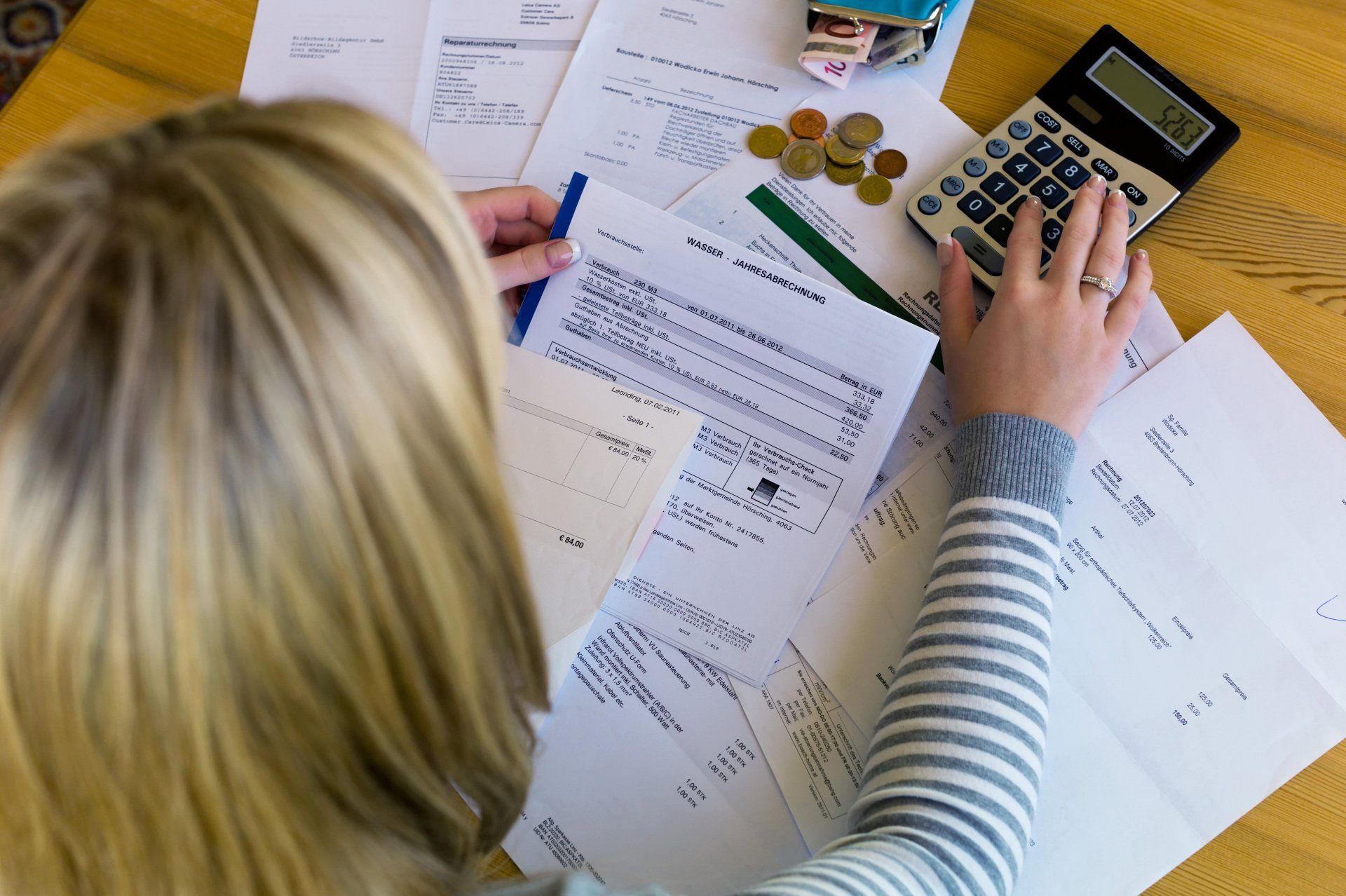 a woman with unpaid bills has many debts. unemployment and personal bankruptcy