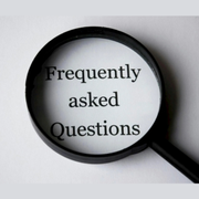 Magnifying glass over the words “Frequently asked Questions” on a white background