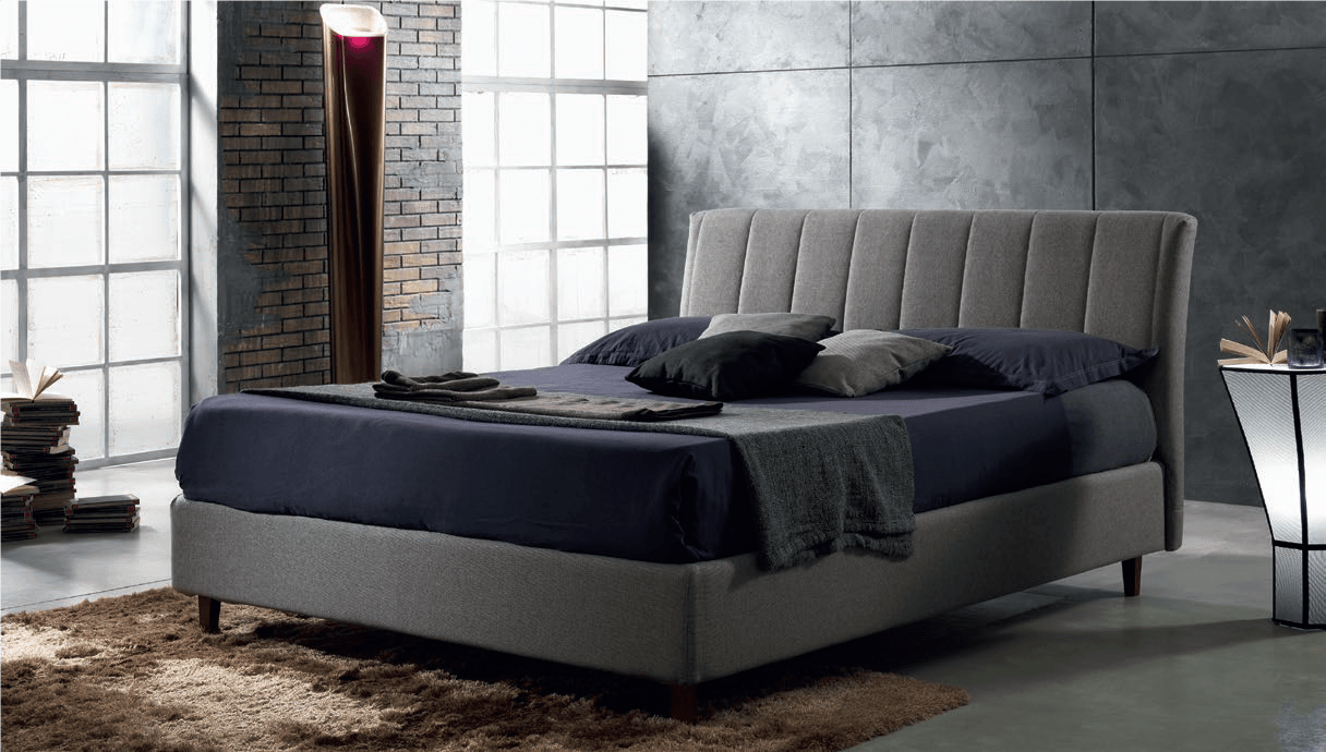 camera con arredi moderni e letto imbottito