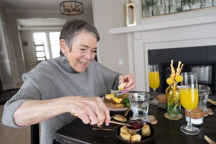 Guest enjoying putting jam on biscuits