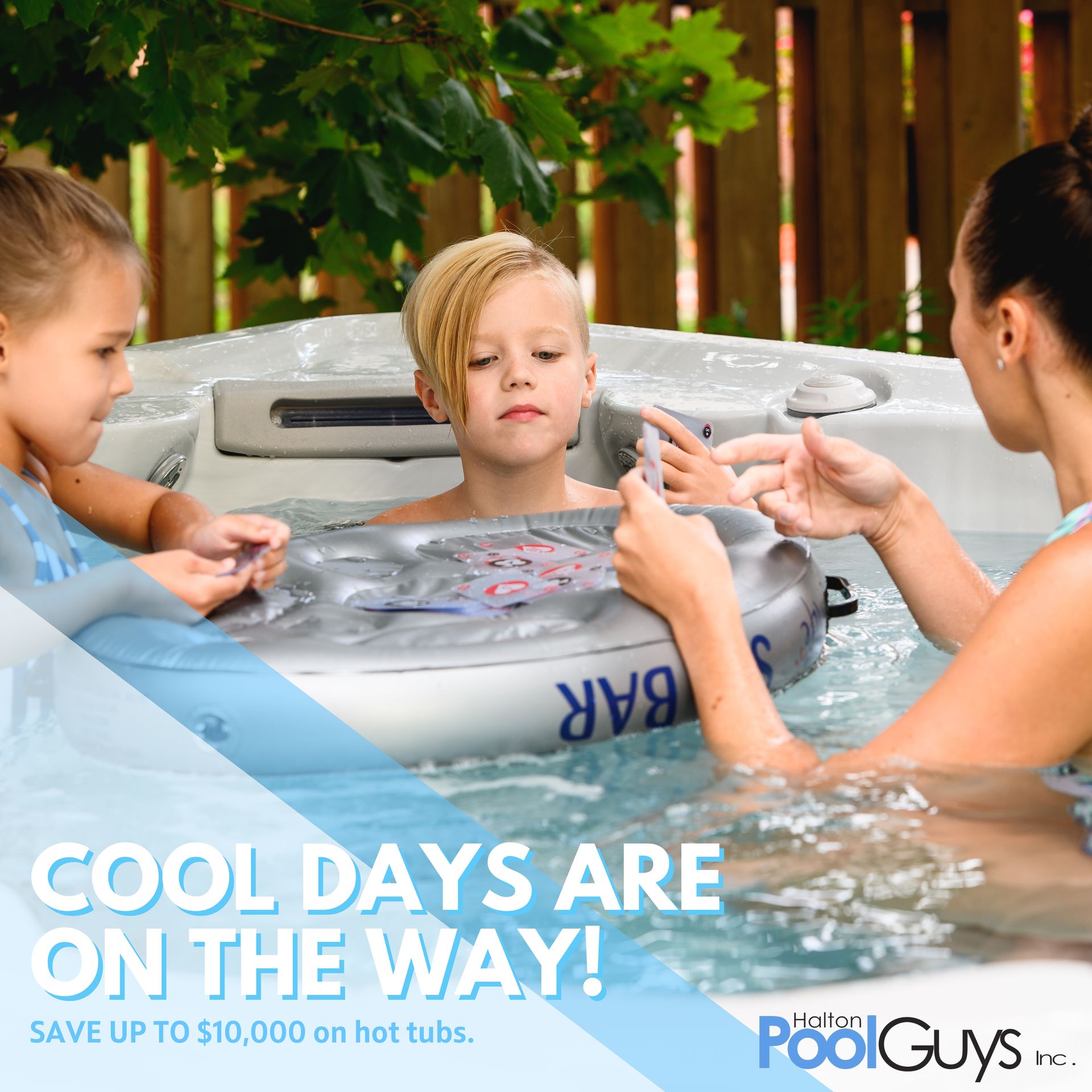 A woman and two children are sitting in a hot tub.
