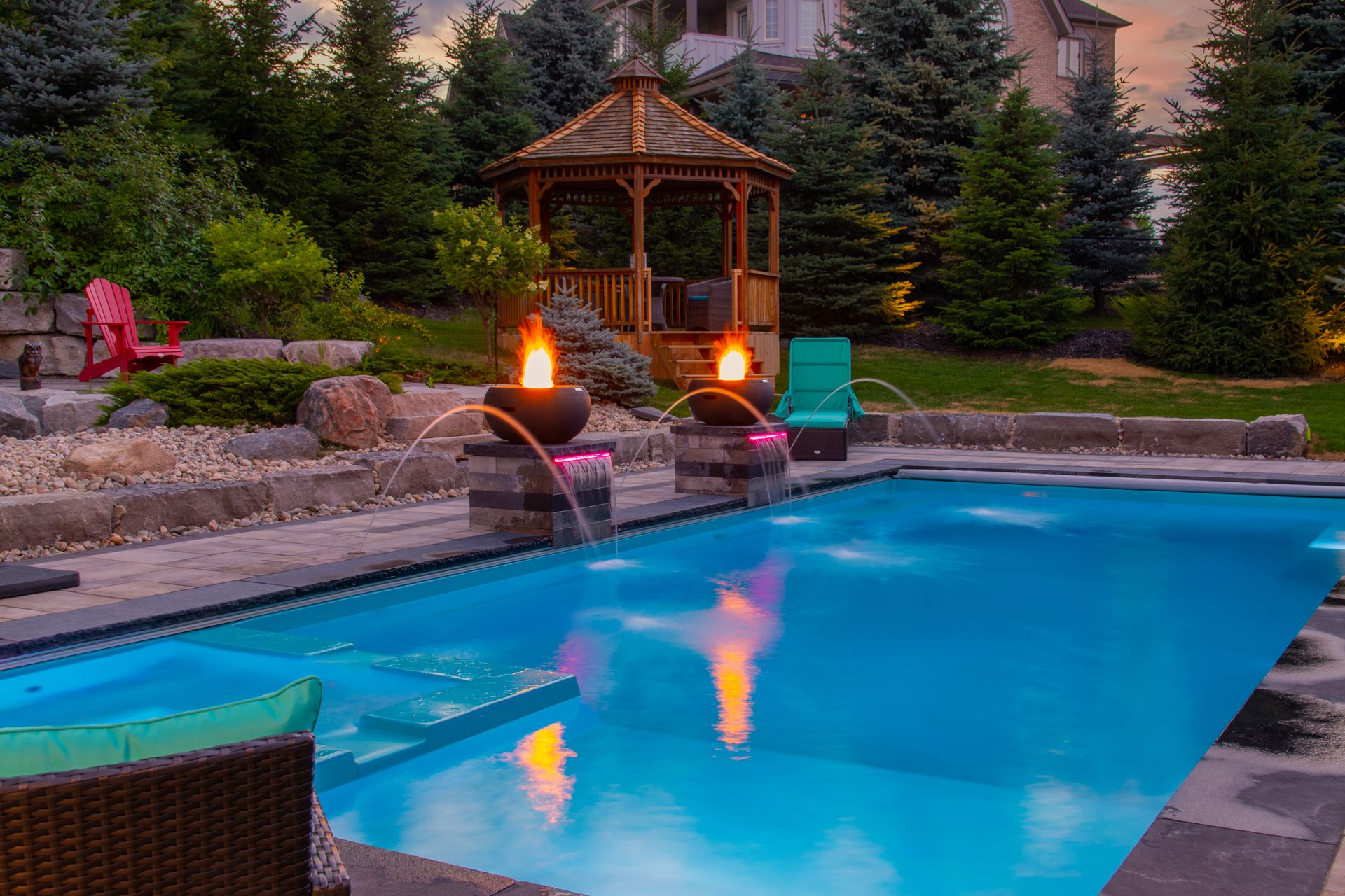 A large swimming pool with a gazebo in the background.
