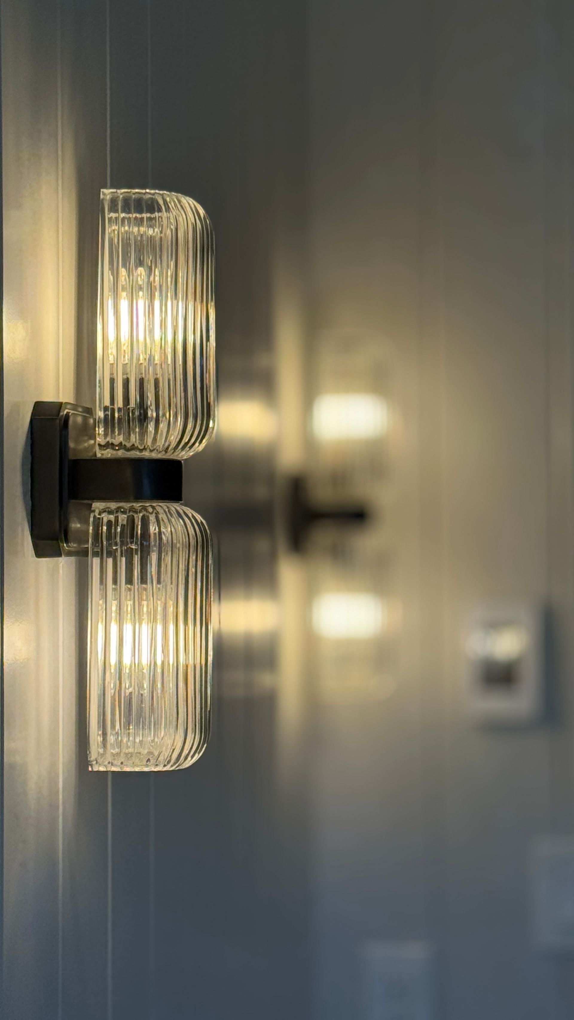 A close up of a wall light on a wall.
