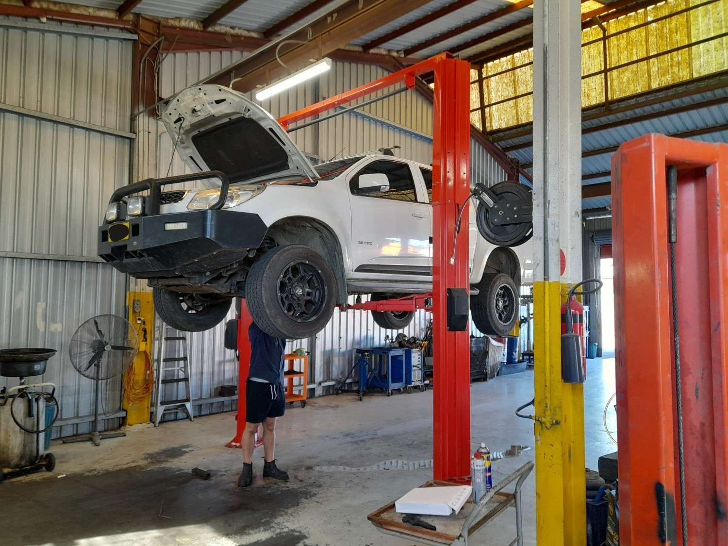 A Truck Is Sitting on A Lift in A Garage — All Mechanical Services in South Murwillumbah, NSW