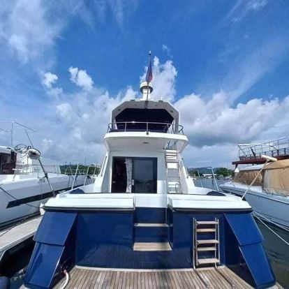 Rear view of a detailed white and blue yacht