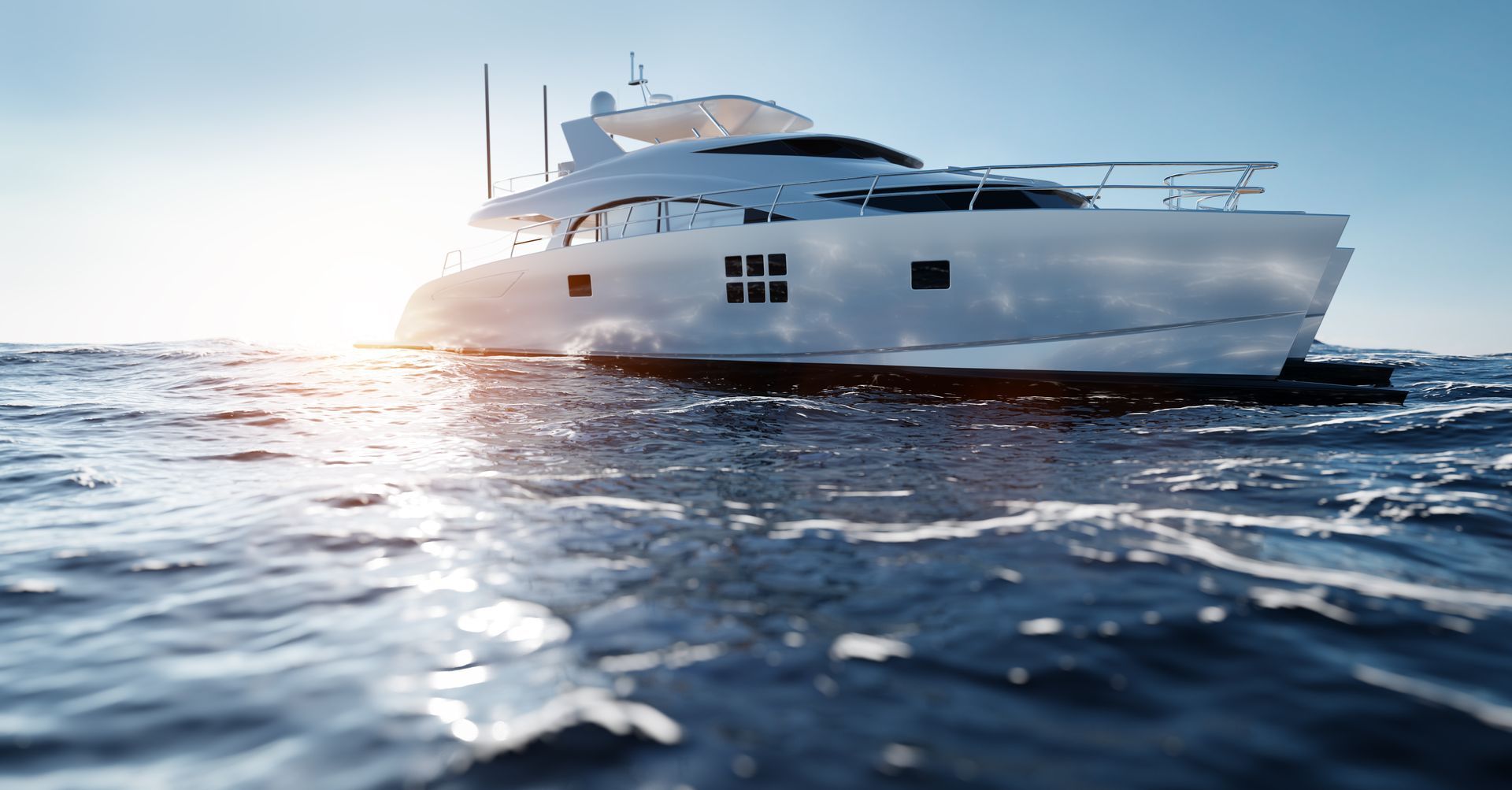 A large white yacht is floating on top of a body of water.