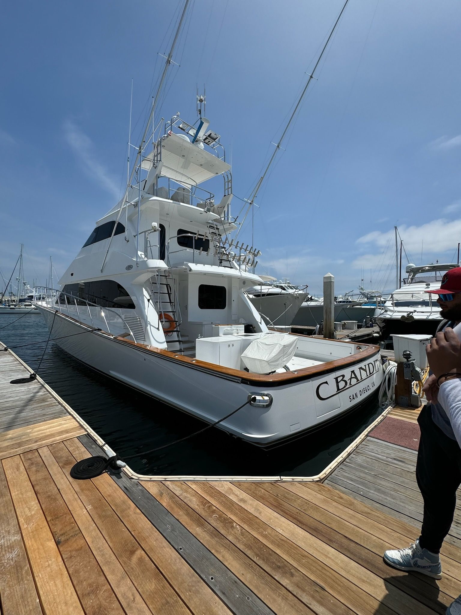 Clean white yacht docked at a marina