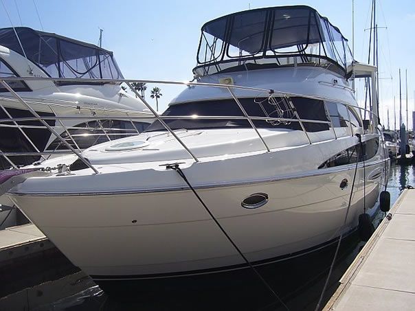 White motor yacht with polished exterior and dark windows