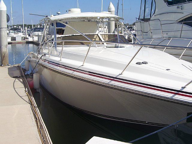 White motorboat with cleaned exterior and restored trim