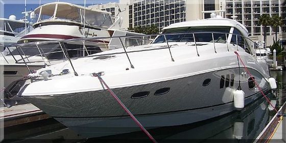 White yacht docked at a San Diego marina after detailing