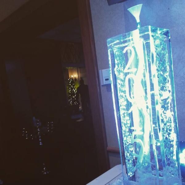 Glowing blue table number display reading “20” in a dim indoor setting