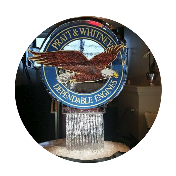 Pratt & Whitney Dependable Engines logo with eagle above a fountain of water indoors