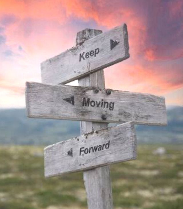 A sign that says Keep Moving Forward.