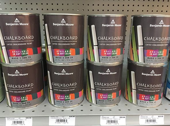 A shelf full of benjamin moore chalkboard paint.