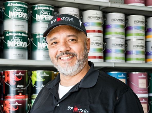 A man wearing a black shirt that says first choice.
