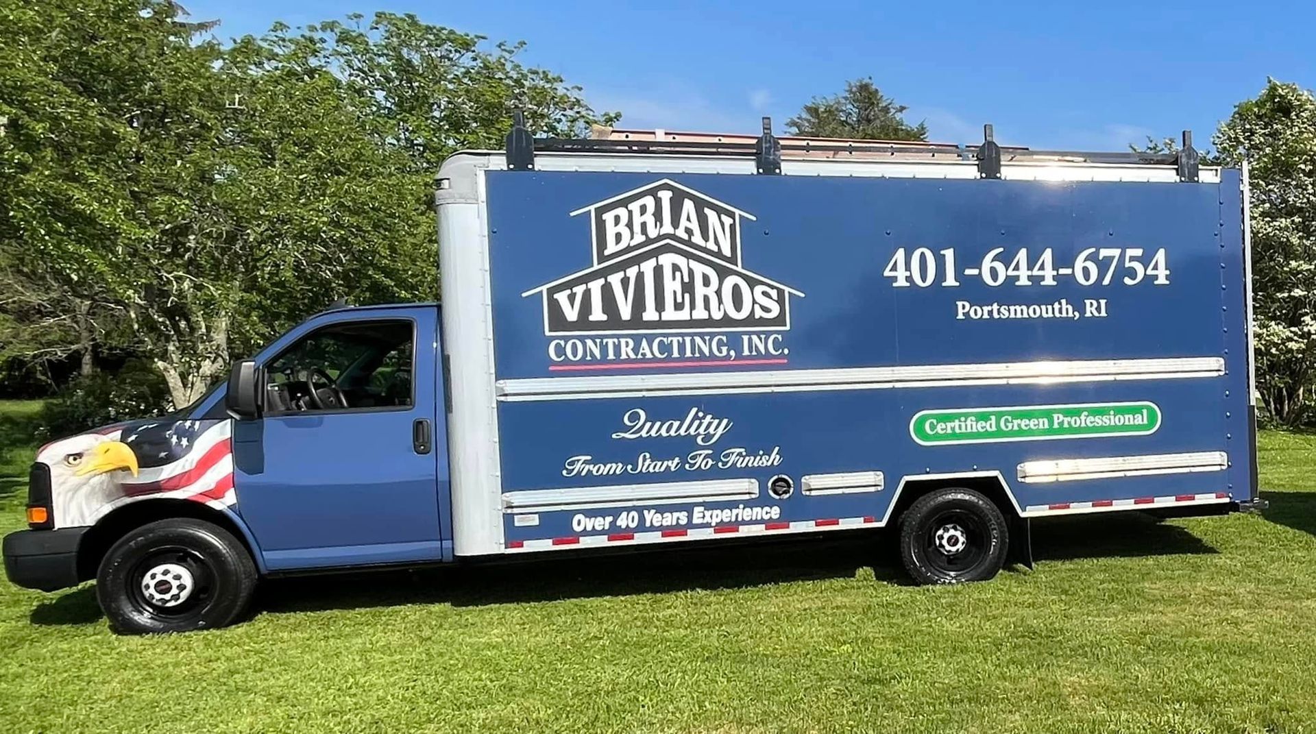 Blue Brian Viveros contracting truck parked on grass with large business signage and phone number.