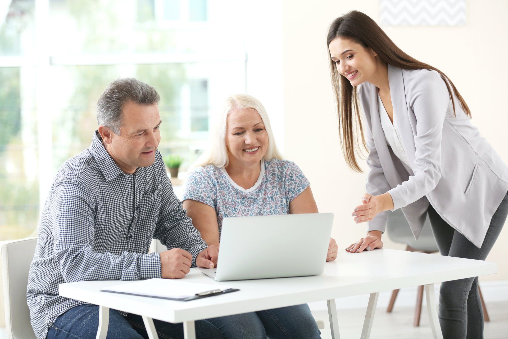 Female Insurance Agent Consulting Senior Couple