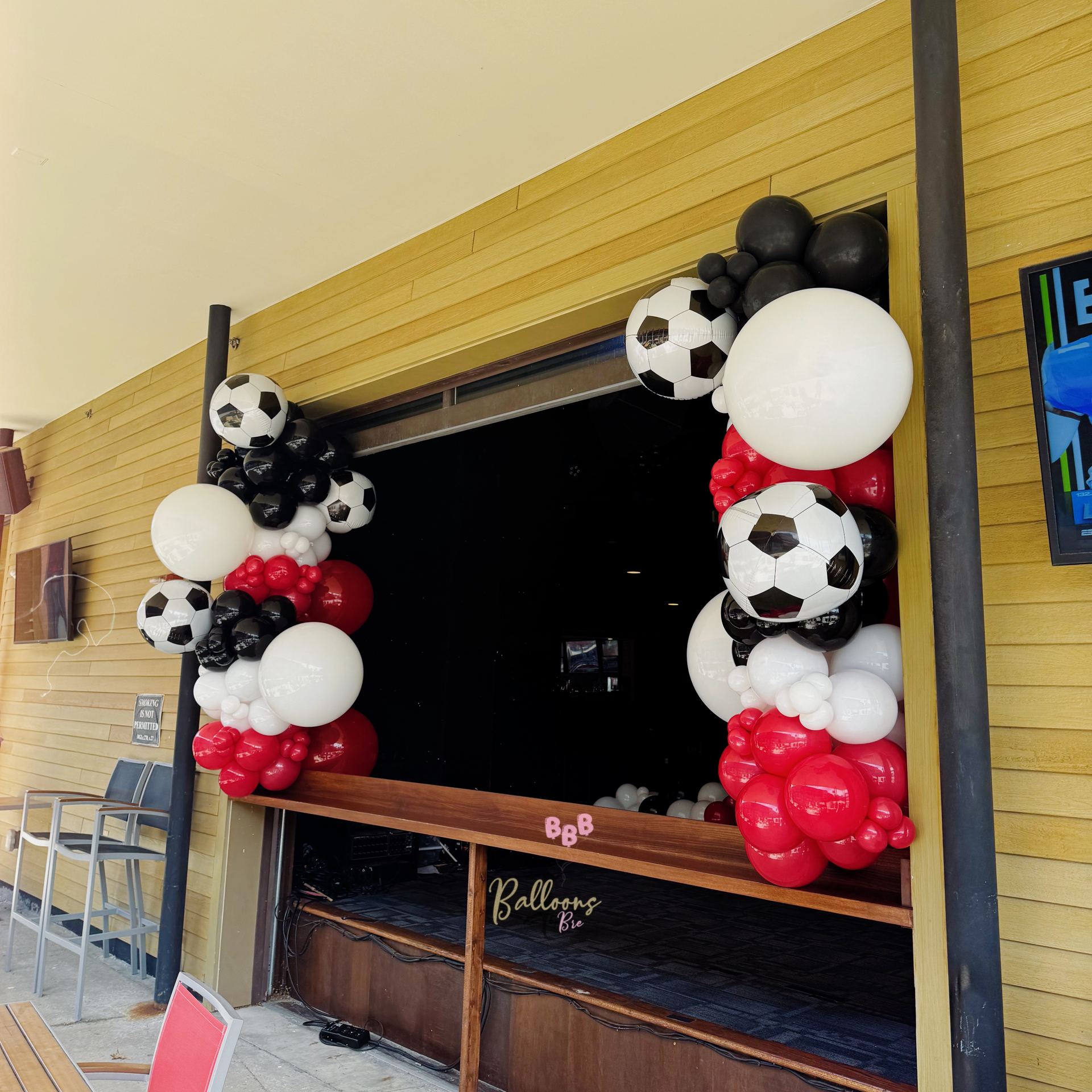 Custom balloon décor installation by Balloons By Bre