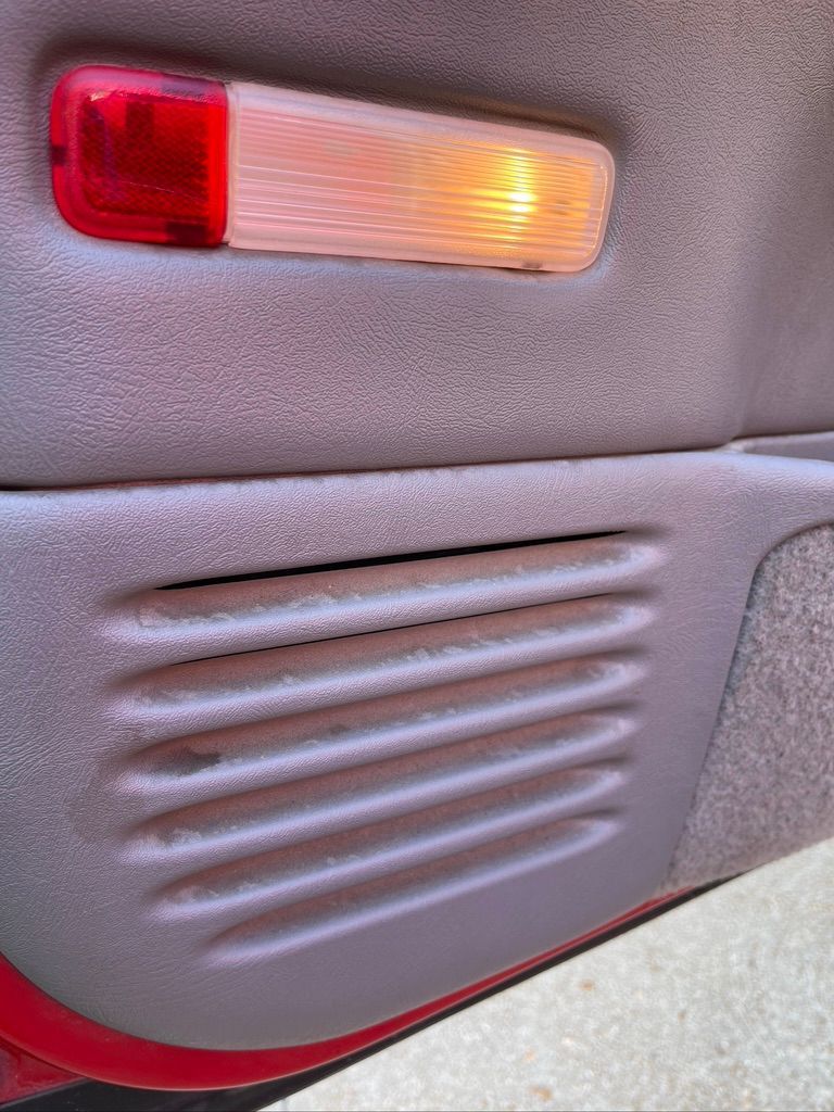 A car door with a red light on it