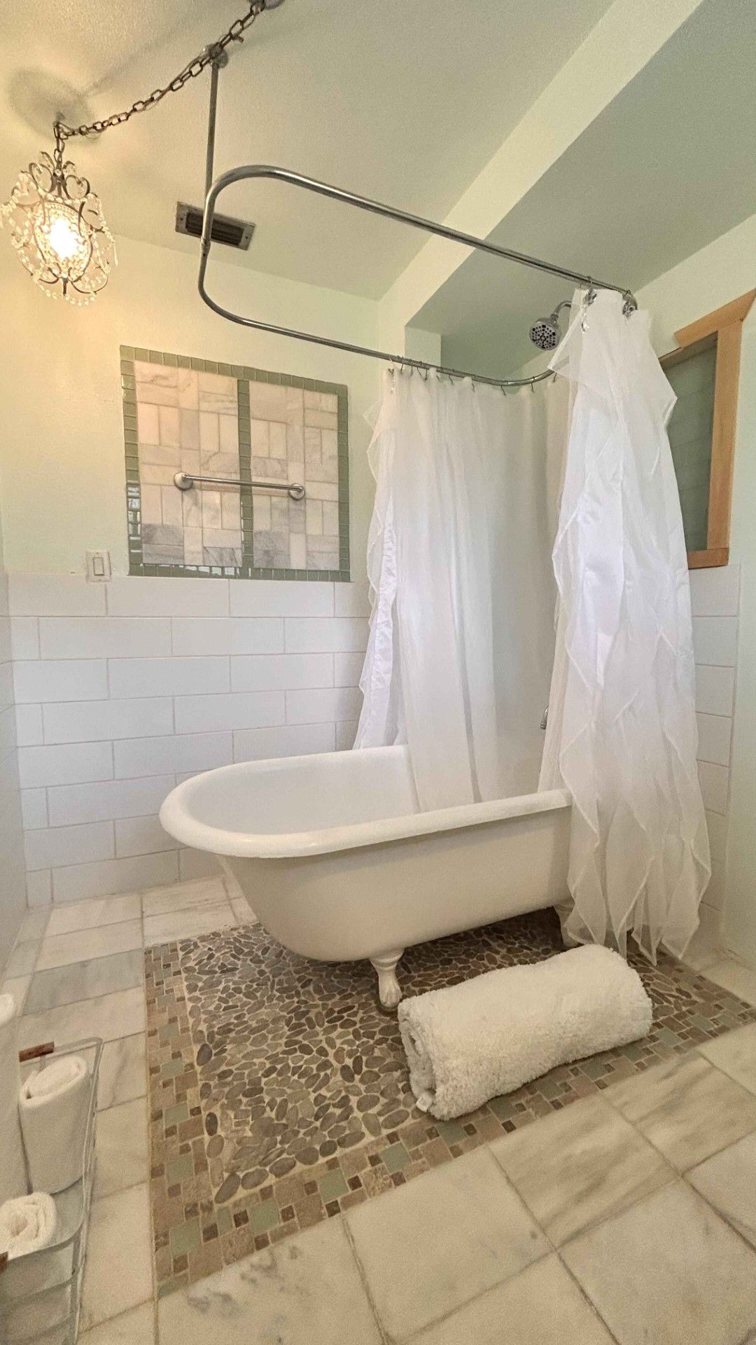A bathroom with a bathtub and a shower curtain.